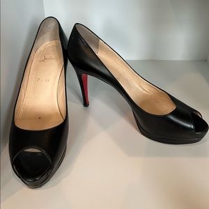 Christian Louboutin peep toed pumps.